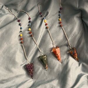 Orgonite pendulums infused w chakra balancing, healing crystals & reiki energy.
